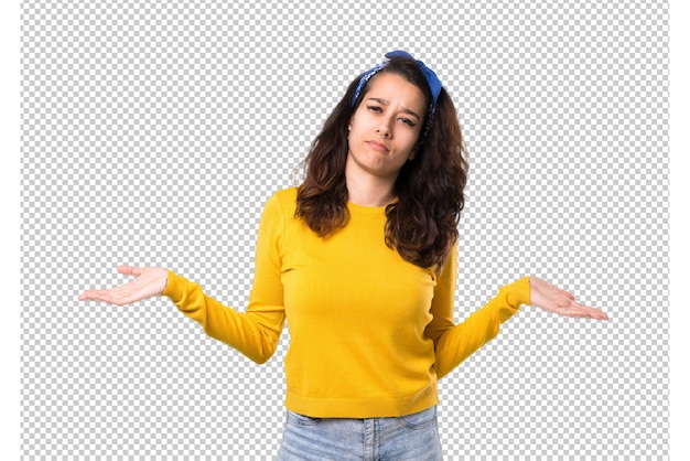 Young girl with yellow sweater and blue bandana on her head unhappy 