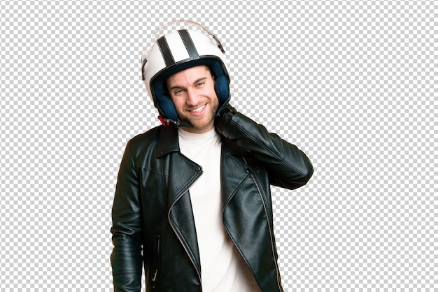 Young handsome blonde man with a motorcycle helmet over isolated chroma key background laughing