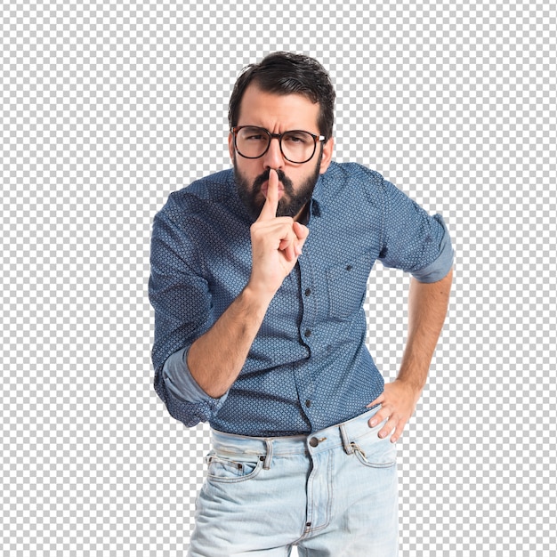 Young hipster man making silence gesture