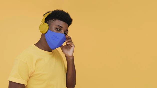 Young male portrait with covid mask