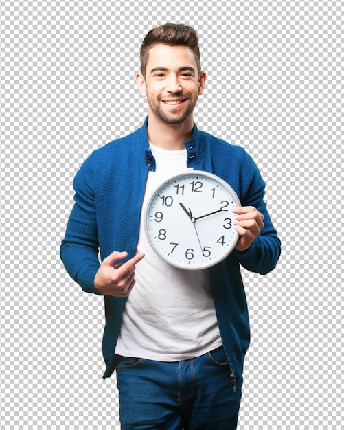 Young man holding a clock