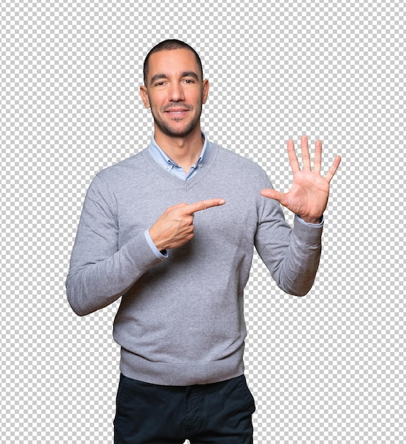 Young man pointing to his wrist