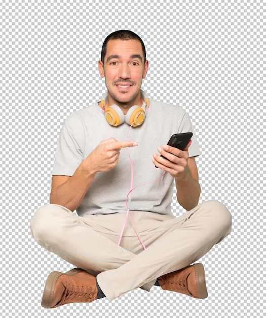 Young man in sitting position with a satisfaction gesture