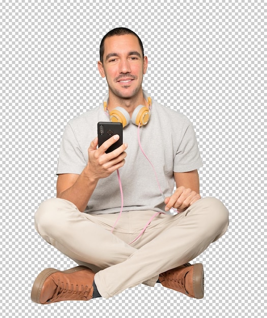 Young man in sitting position with a satisfaction gesture