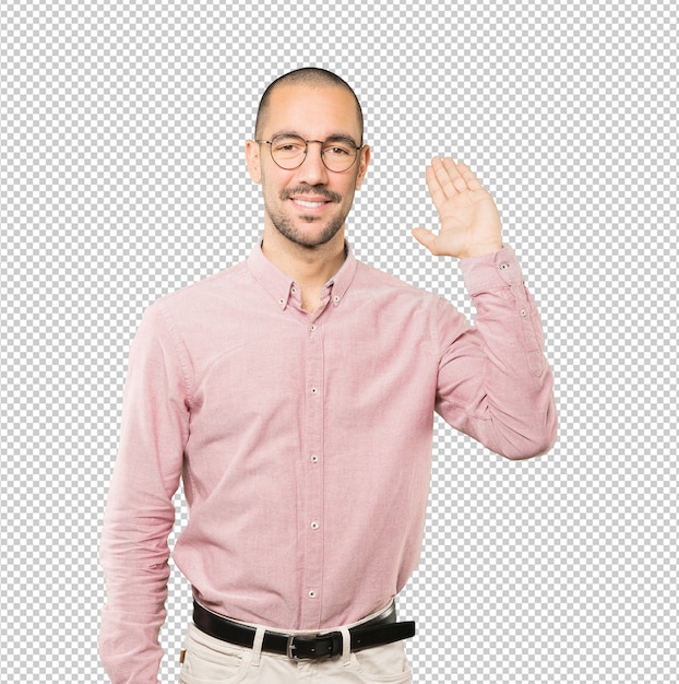 Young man waving with his hand