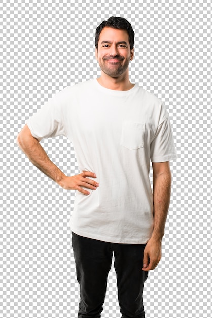 Young man with white shirt posing with arms at hip and smiling