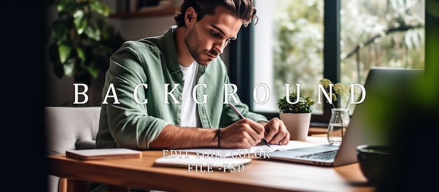 PSD young man writing at a desk with laptop