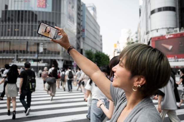 Young person using phone mockup