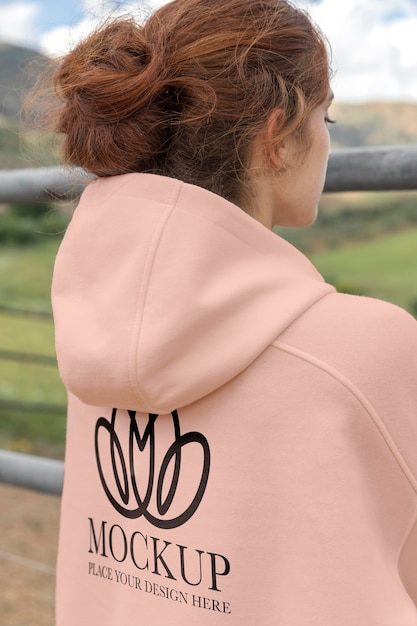 Young woman wearing a mock-up hoodie