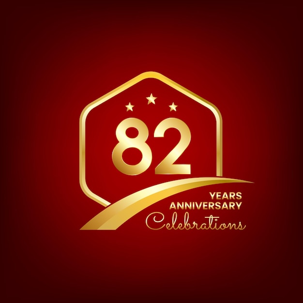 82 years anniversary inside of gold hexagon and curve with red backgrounds