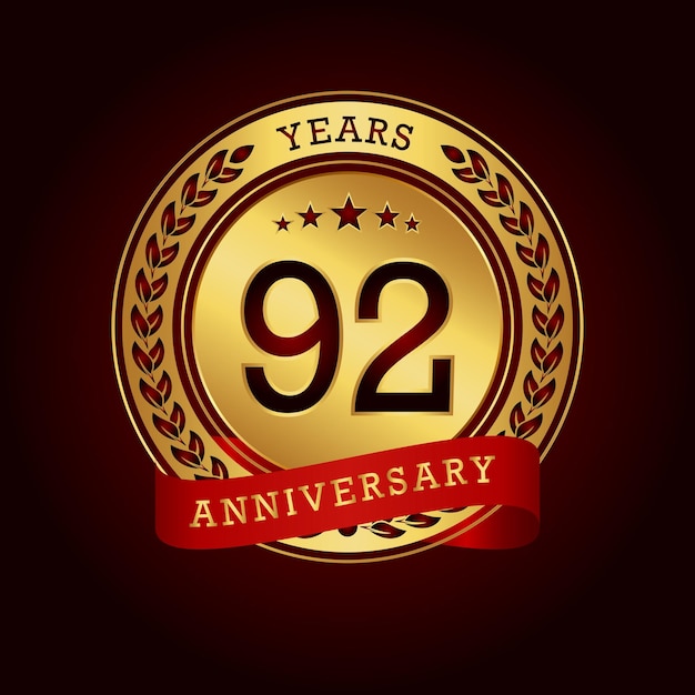 92 years anniversary with a golden circle and red ribbon in a dark red background