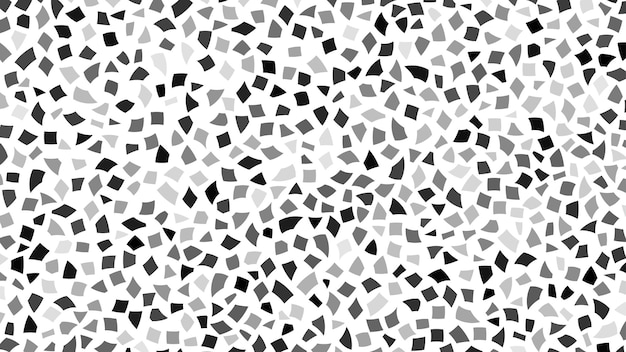 Abstract backdrop of small black and gray pieces of paper or splinters of ceramics on white background