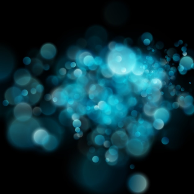 Abstract defocused circular blue bokeh on dark background. 