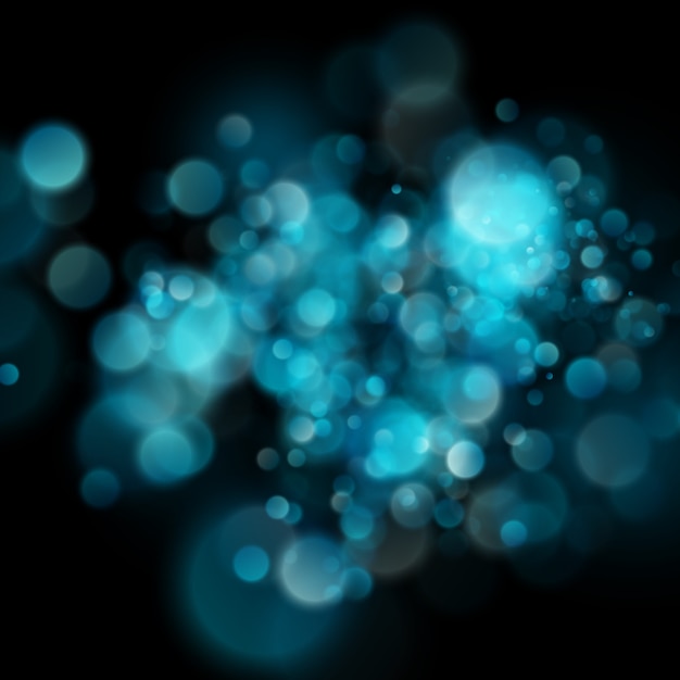 Abstract defocused circular blue bokeh on dark background. 