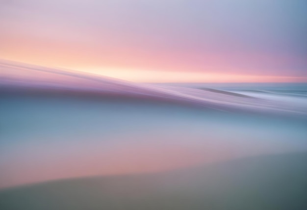 Abstract and dreamy seascape with a soft blurred wave captured during a colorful sunset creating a serene and ethereal atmosphere