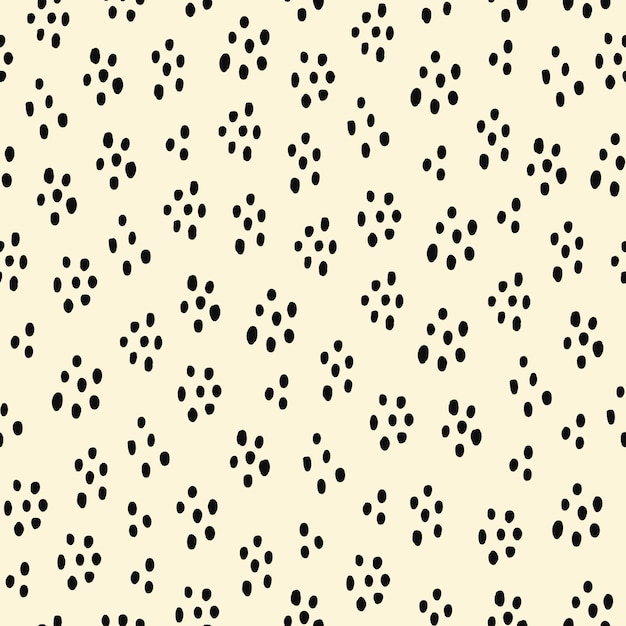 Abstract seamless pattern with black speckles on a beige background. Vector hand drawn illustration