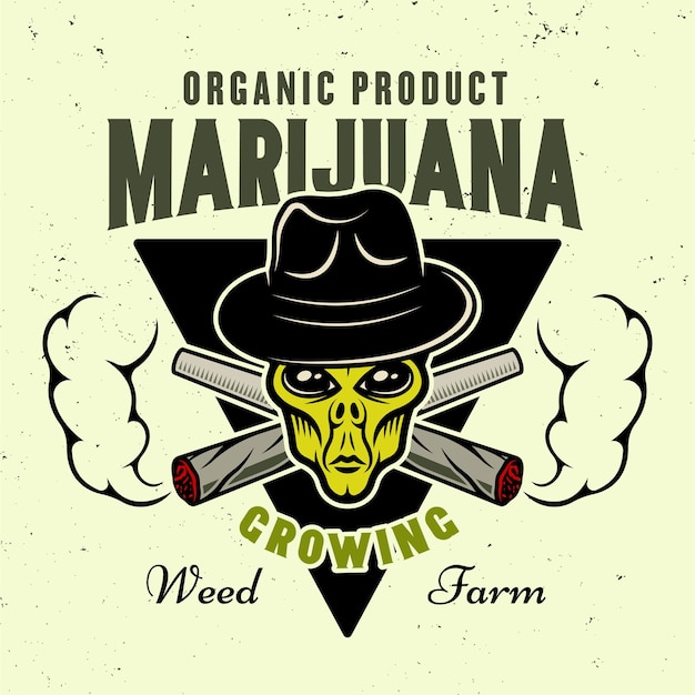 Alien green head in hat and two crossed weed joints with smoke vector emblem badge label or logo for marijuana growing company in colorful style isolated on light background