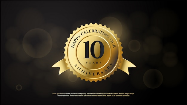 Anniversary celebration number with the number 10 in gold in a gold emblem.