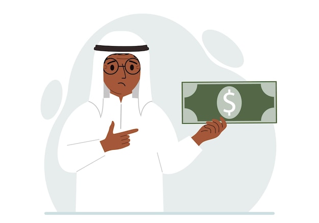 A arab man holds a large paper bill in his hand The concept of income expense earning or spending money