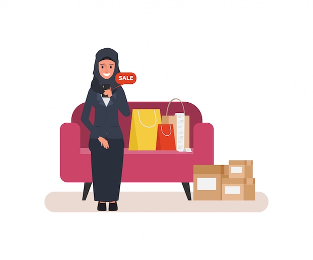 Arab woman shopping online with mobile phone at home.