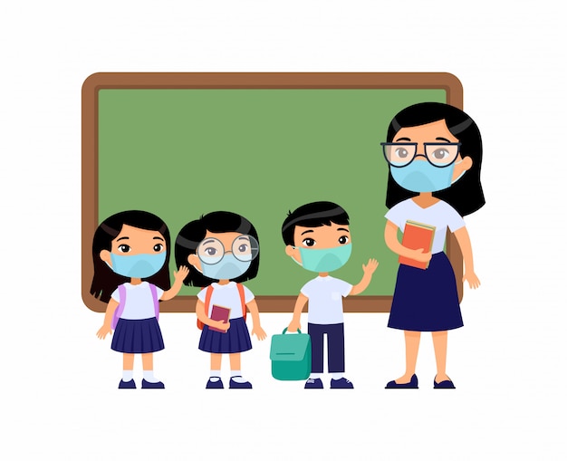 Asian female teacher and pupils  with protective masks on their faces. Boys and girls dressed in school uniform and female teacher pointing at blackboard cartoon characters. Respiratory protection