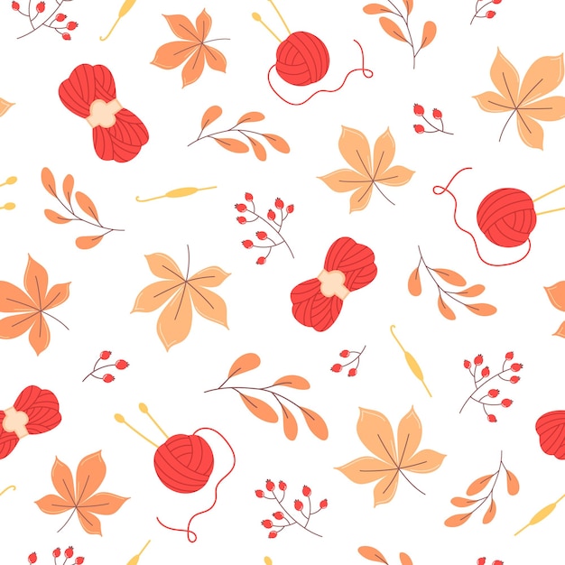 Autumn seamless pattern of orange leaves and yarn