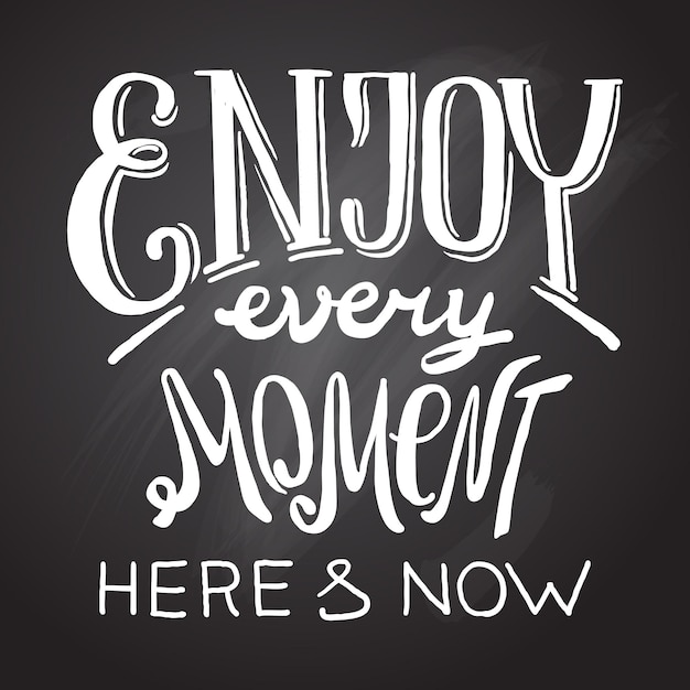 Beautiful hand drawn lettering enjoy every moment on the chalkboard