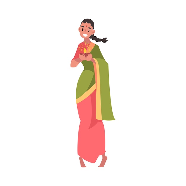 Beautiful indian woman in national dress standing with candle in candlestick people celebrating