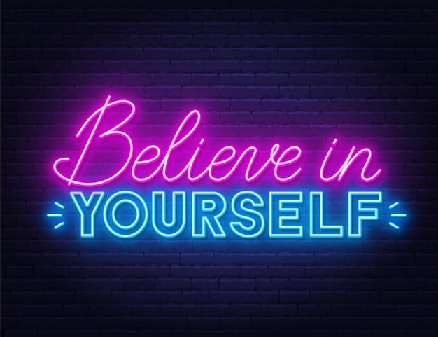 Believe in yourself neon inspirational quote on a brick wall.