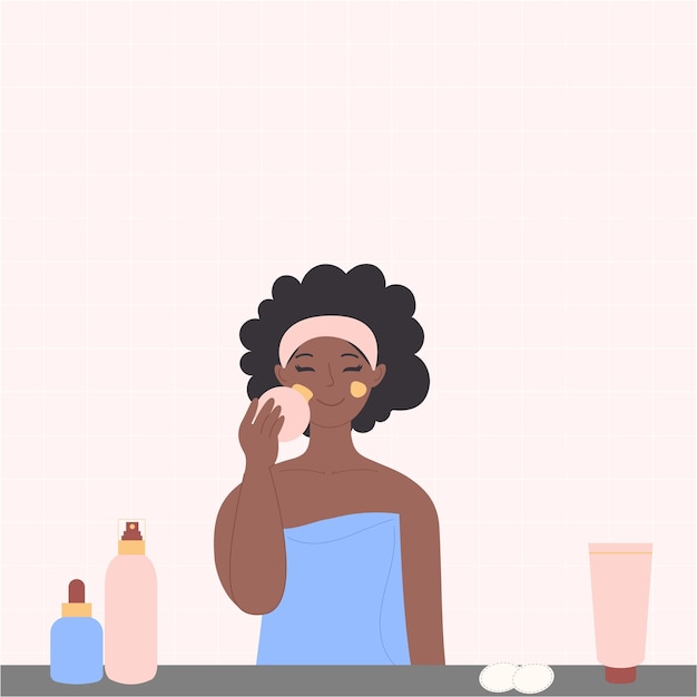 A black AfricanAmerican woman is washing her face with cosmetics in the bathroom