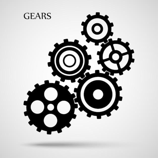 black toothed gears is meshed on grey background