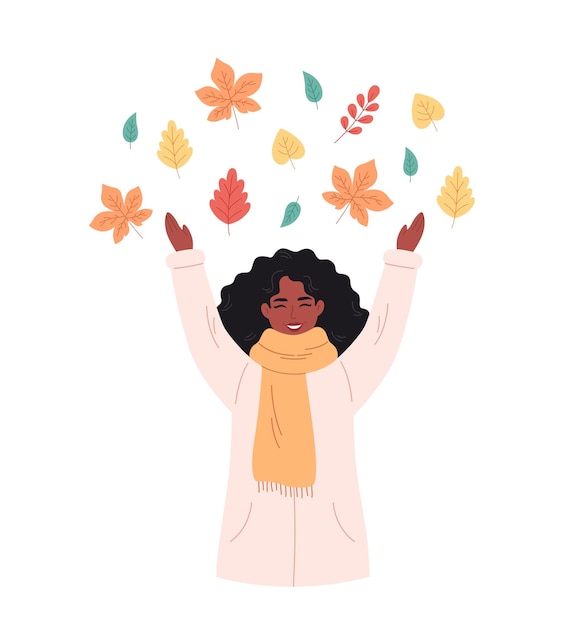 Black woman greeting autumn season. Happy woman playing with autumn foliage. Hello autumn