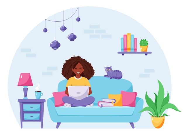 Black woman sitting on a sofa and working on laptop Freelancer home office