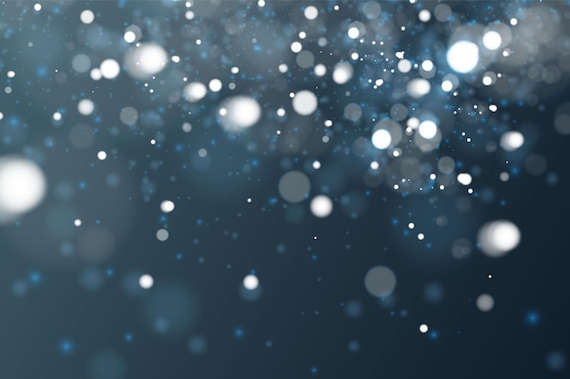 Blurred bokeh light on dark blue background. Christmas and New Year holidays template. Abstract glitter defocused blinking stars and sparks.