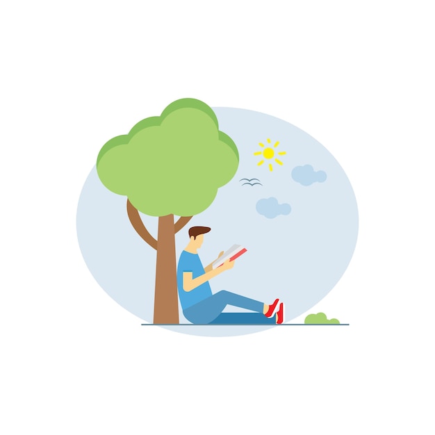 A boy sitting under a tree and reading a book