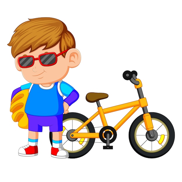 a boy standing on the bike