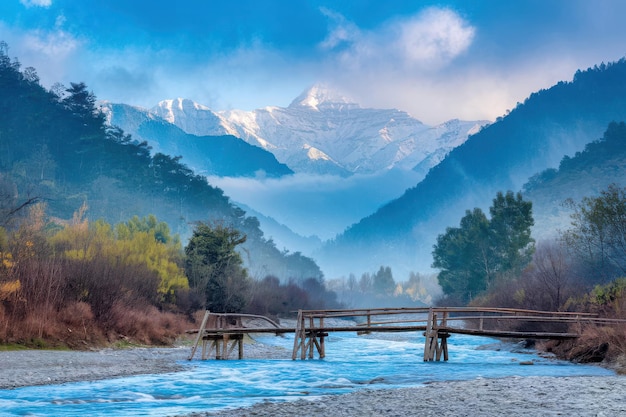 Vector a bridge over a river with a mountain in the background