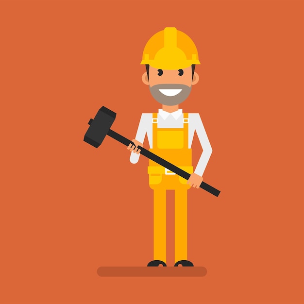 Builder holding big hammer and smiling