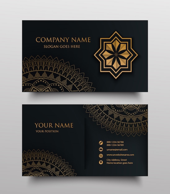 Business card with gold floral ornamental logo and place for text on dark background