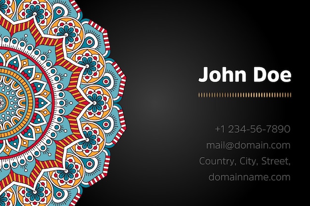 Business card with gold mandala design