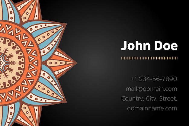 Business card with gold mandala design