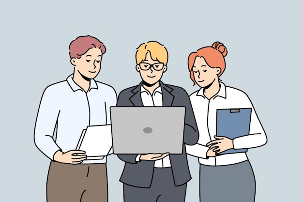 Business people stand together look to computer