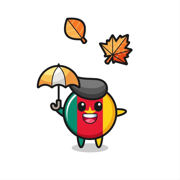 Cartoon of the cute cameroon flag badge holding an umbrella in autumn