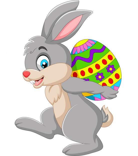 Cartoon rabbit carrying an Easter egg