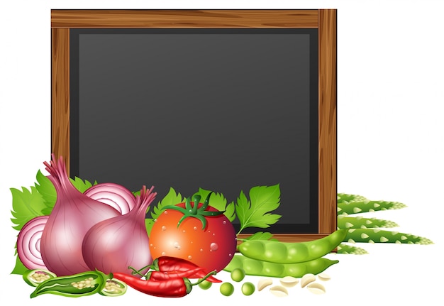 Chalkboard with fresh vegetables in background