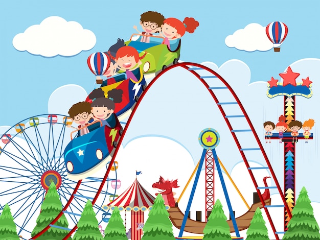 Children and rides at amusement park