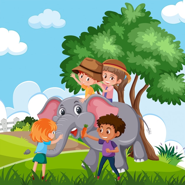 Children riding elephant in nature