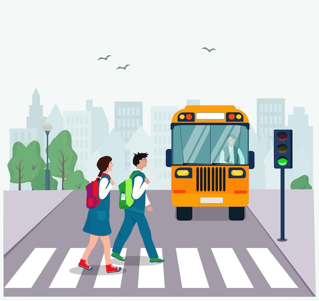 Children with backpacks cross the road at a pedestrian crossing at a green light.  Traffic rules.