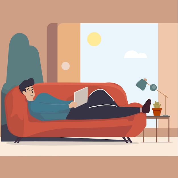 Chilling guy on the sofa reading on a tablet