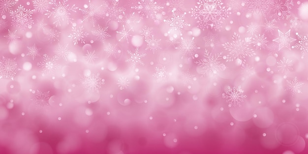 Christmas background of complex big and small falling snowflakes in pink colors with bokeh effect